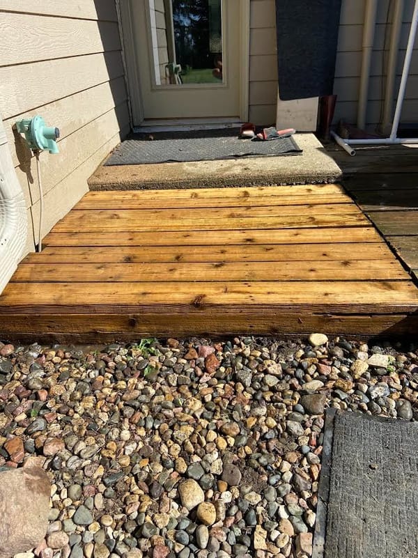 Completed landscaping project with rock beds and clean edging