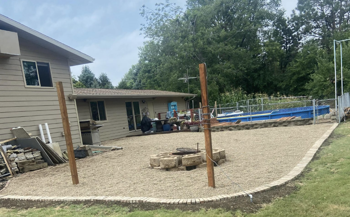 Freshly landscaped front yard with clean edging and rock beds in Sioux Falls